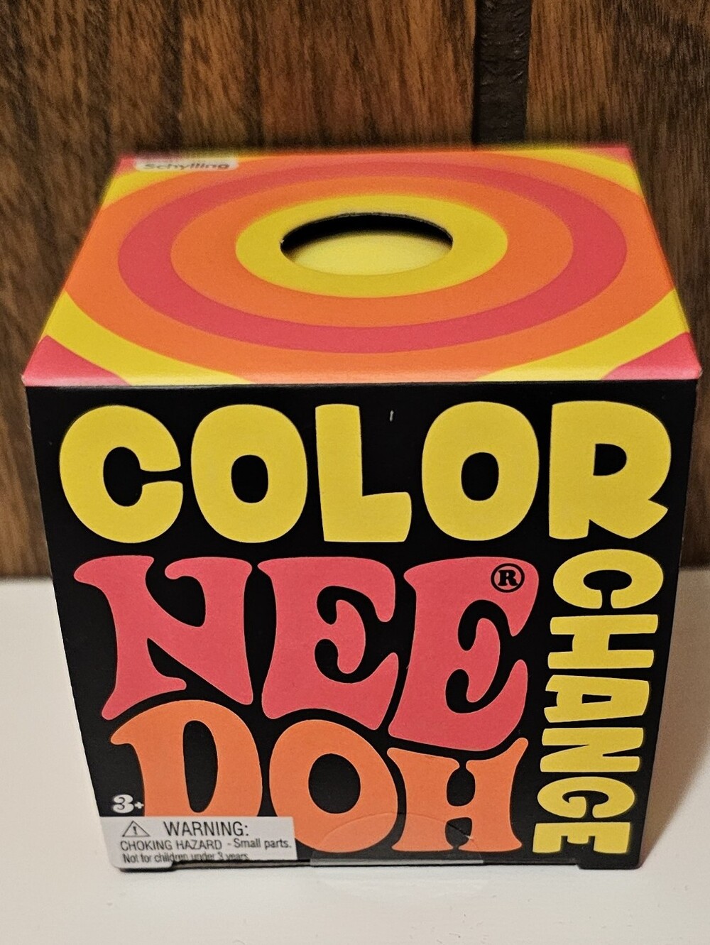 Color NeeDoh Change Cube – Black with Pink, Orange, and Yellow Accents